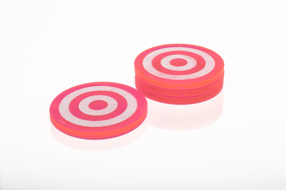 Alexandra Von Furstenberg Acrylic lucite round bullseye drink coasters in pink stacked in a pile set of 4