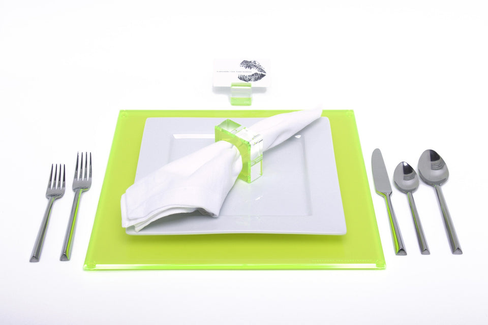 Alexandra Von Furstenberg Acrylic Square Placemat set in neon green with table setting including acrylic napkin ring and acrylic place card holder