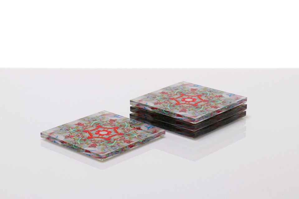 Alexandra Von Furstenberg Acrylic lucite square drink coasters in kaleidoscope Print stacked in a pile set of 4