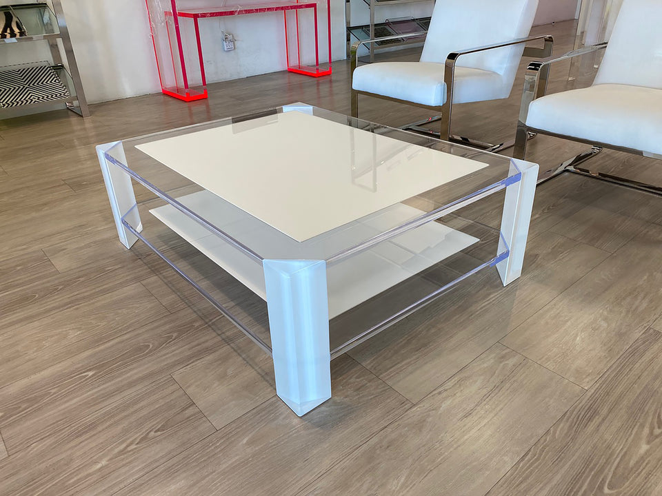 Alexandra Von Furstenberg acrylic lucite clear and white coffee table in showroom