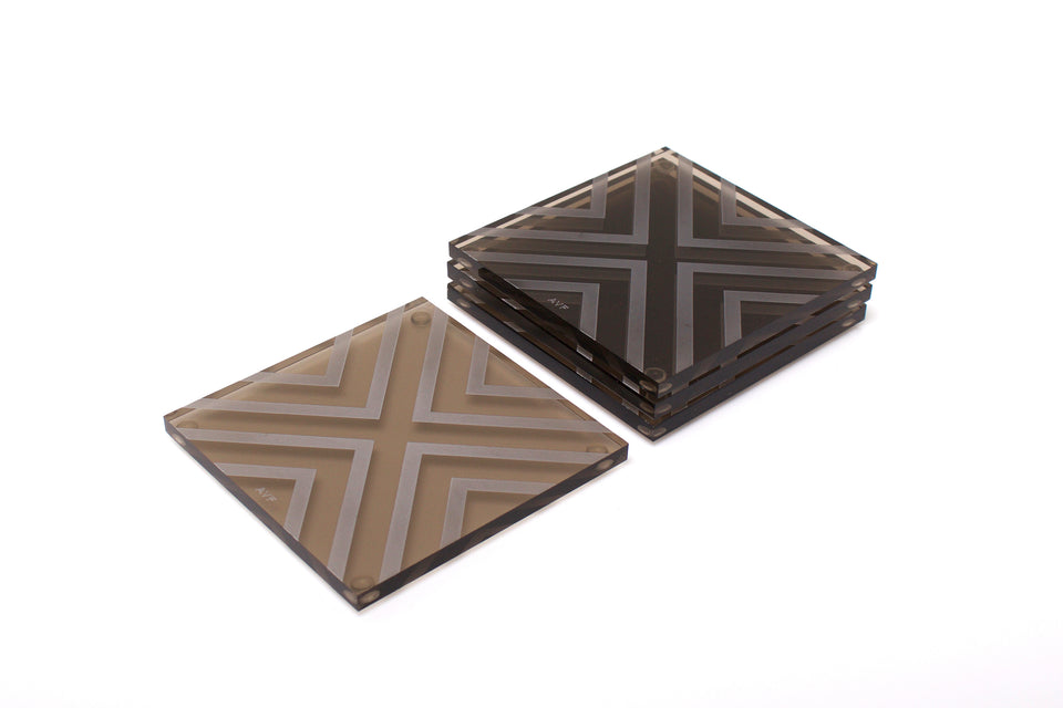 Alexandra Von Furstenberg Acrylic lucite square chevron drink coasters in bronze stacked in a pile set of 4