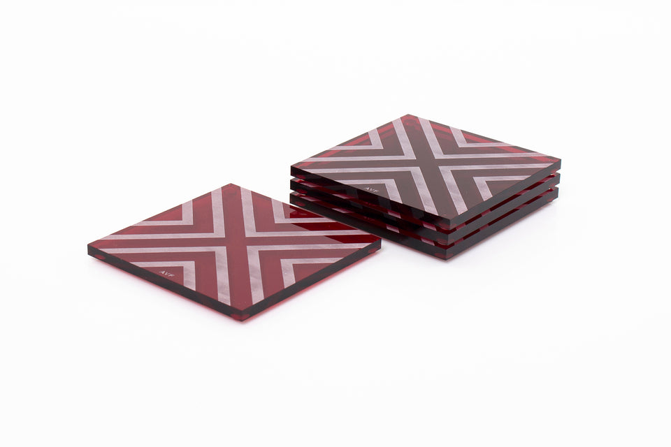 Alexandra Von Furstenberg Acrylic lucite square chevron drink coasters in ruby stacked in a pile set of 4