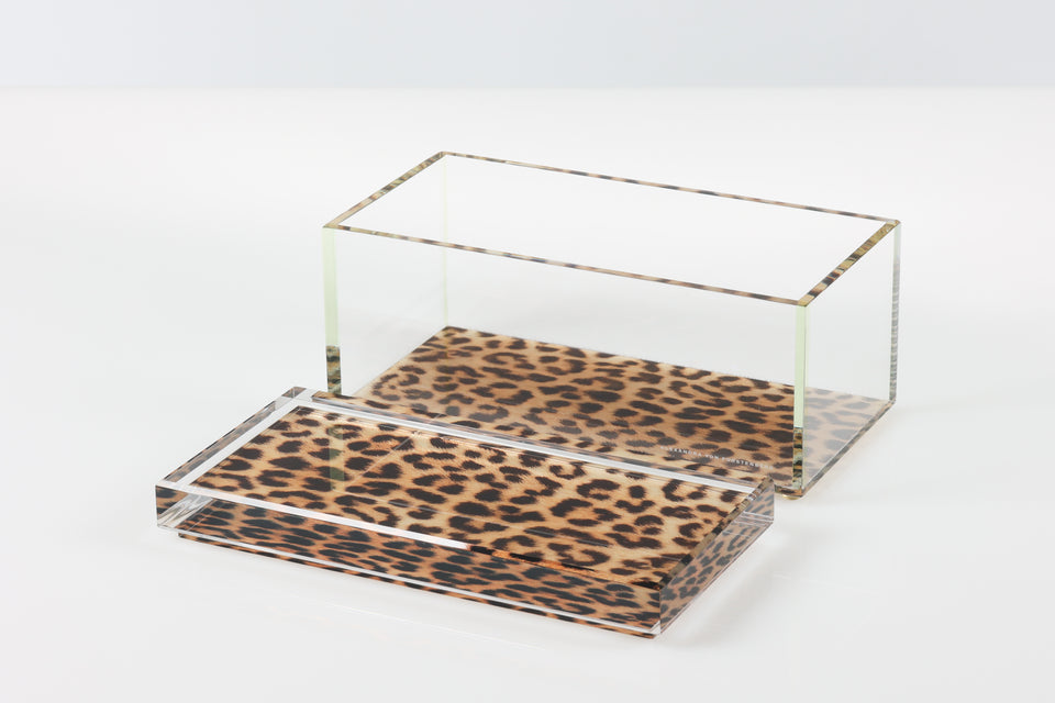 Clear acrylic box with leopard print base on a white background. The lid of the box is off and in front of the base of the box