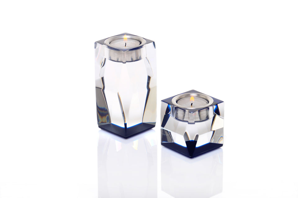 Two luxury sapphire lucite votive candleholders of different sizes. Three and five inch candleholders. 