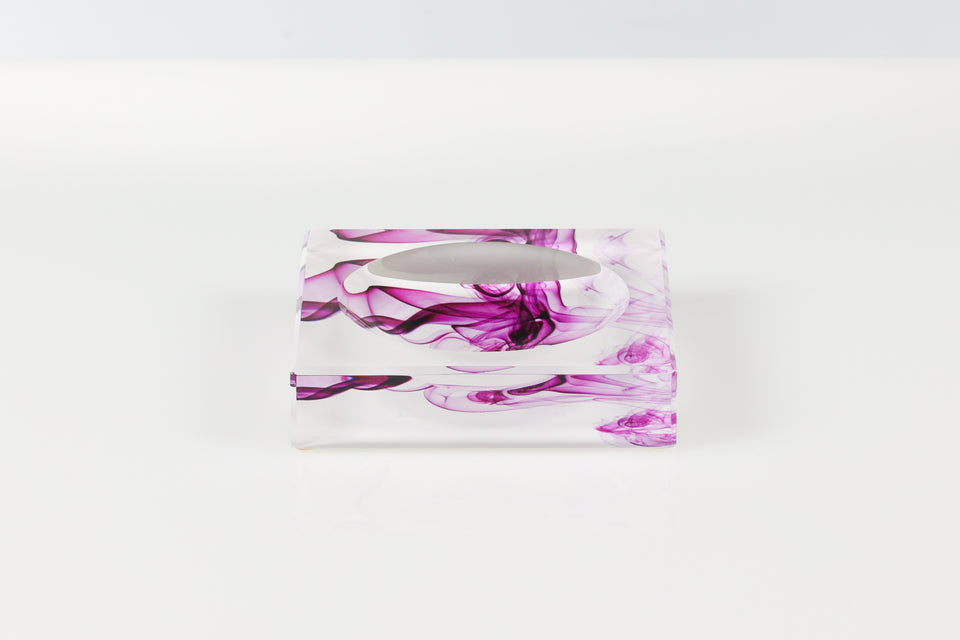 Lucite candy bowl in petite vewed looking down at it. The print pattern on the candy bowl is a white and purple pattern. 