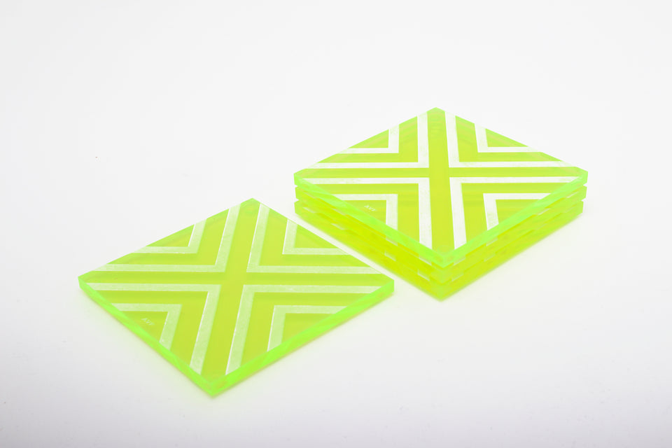 Alexandra Von Furstenberg Acrylic lucite square chevron drink coasters in neon green stacked in a pile set of 4