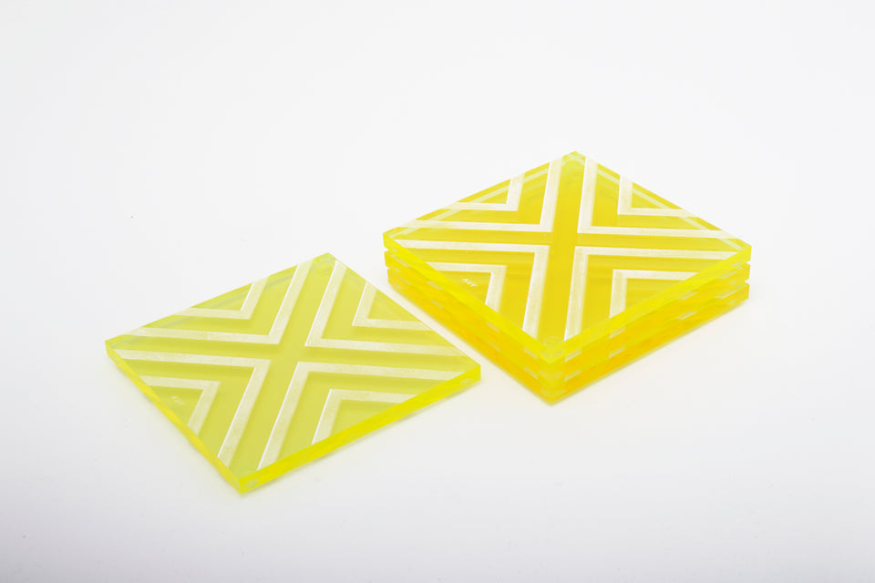 Alexandra Von Furstenberg Acrylic lucite square chevron drink coasters in yellow stacked in a pile set of 4