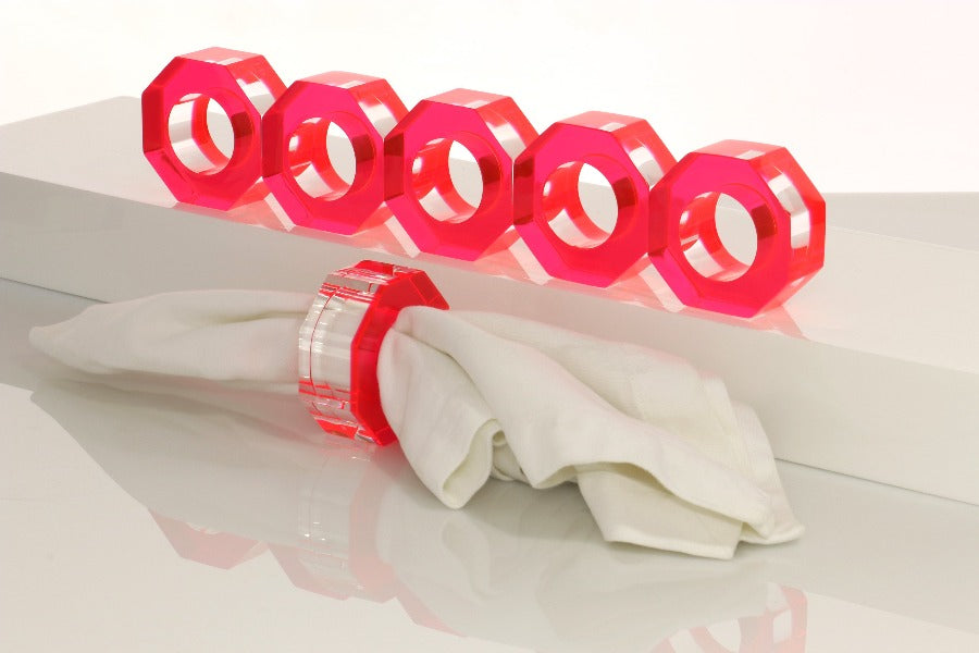 Alexandra Von Furstenberg Acrylic Dinner Napkin Rings in Red showing 6 rings with a napkin in one. 