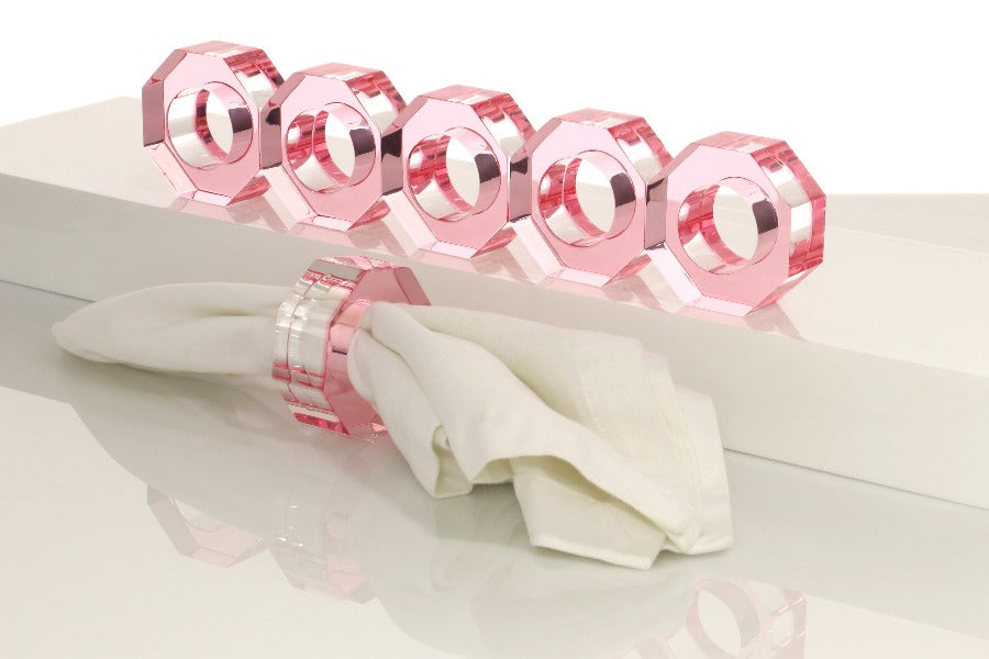 Alexandra Von Furstenberg Acrylic Dinner Napkin Rings in Rose showing 6 rings with a napkin in one. 