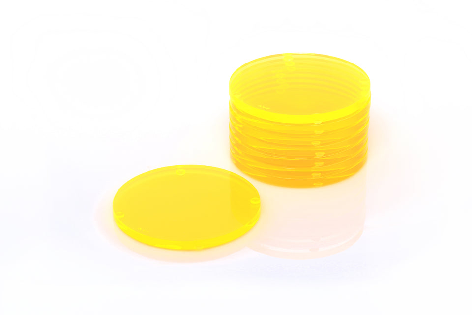 A set of yellow round acrylic coasters displayed both stacked and unstacked on a white background.