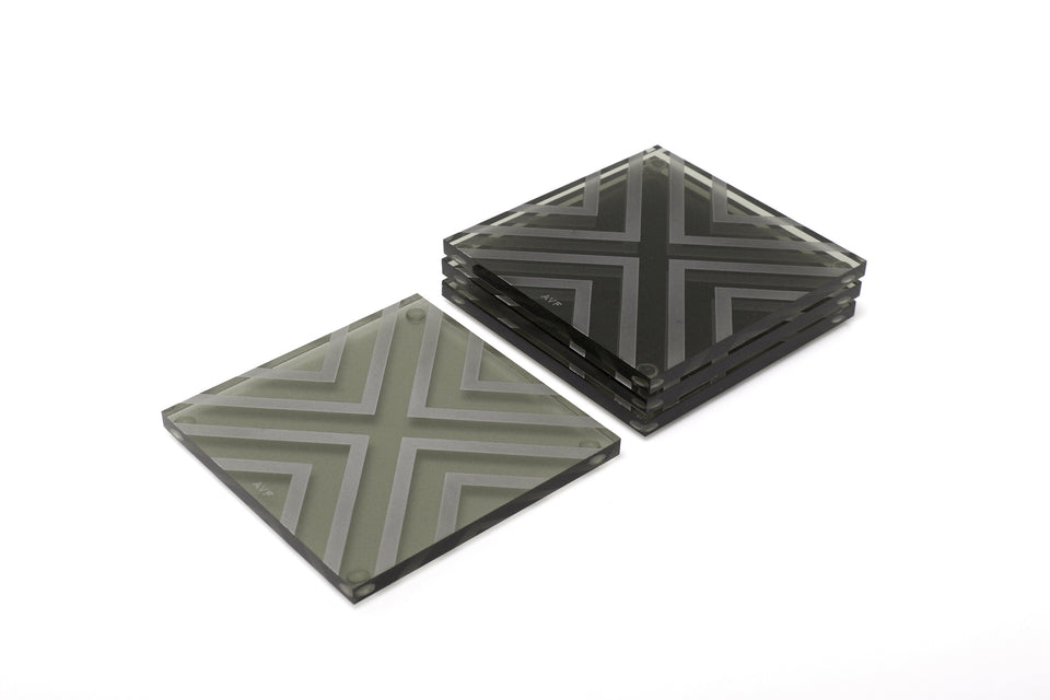 Alexandra Von Furstenberg Acrylic lucite square chevron drink coasters in grey stacked in a pile set of 4