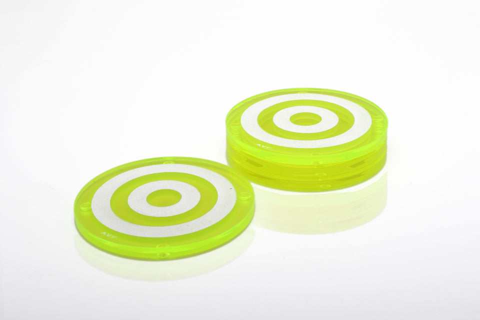 Alexandra Von Furstenberg Acrylic lucite bullseye drink coasters in green stacked in a pile set of 4