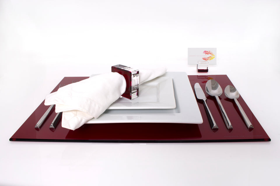 Alexandra Von Furstenberg Acrylic Rectangle Placemat set in Ruby with table setting including acrylic napkin ring and acrylic place card holder 